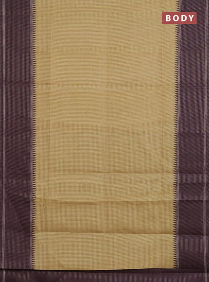 Chappa saree pale yellow and deep wine shade with allover small zari checked pattern and temple design zari woven border