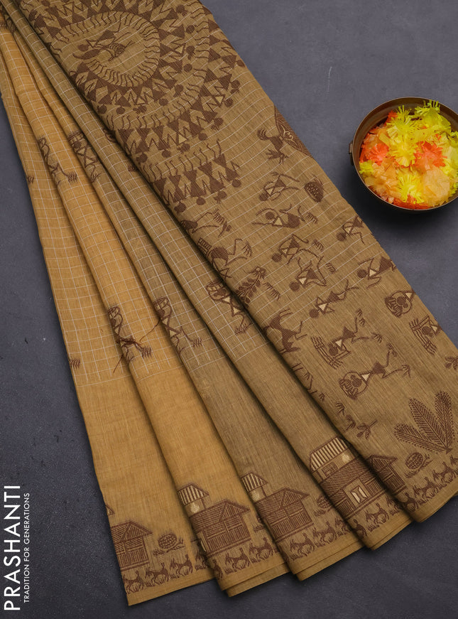 Munga cotton saree sandal and brown with allover checked pattern & thread buttas and warli design weaving pallu