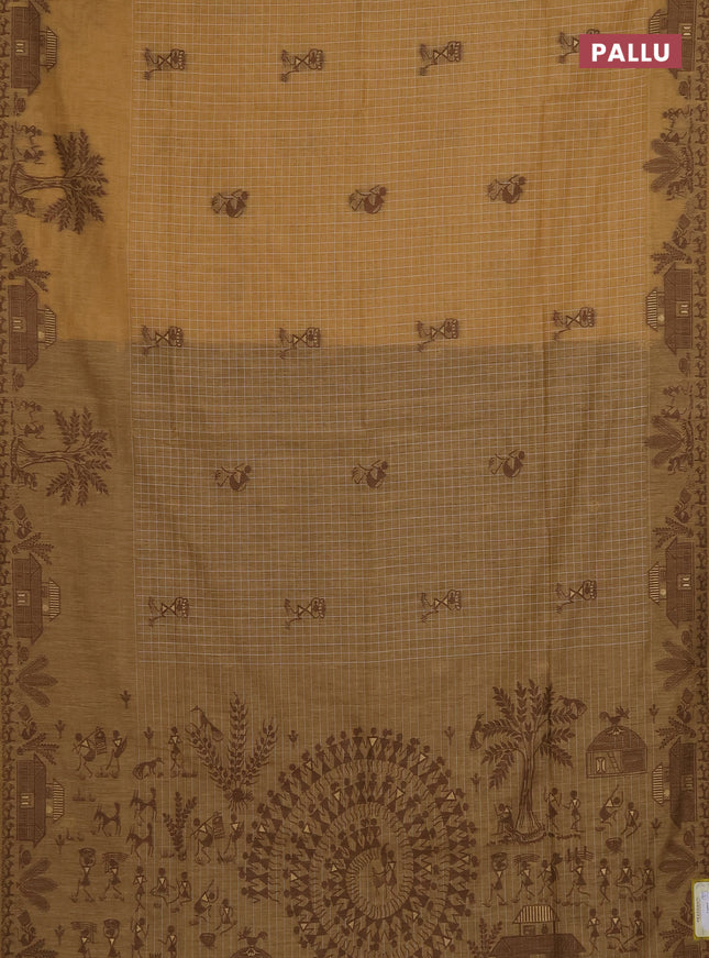 Munga cotton saree sandal and brown with allover checked pattern & thread buttas and warli design weaving pallu