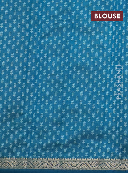 Semi raw silk saree cs blue with floral butta prints and zari woven border