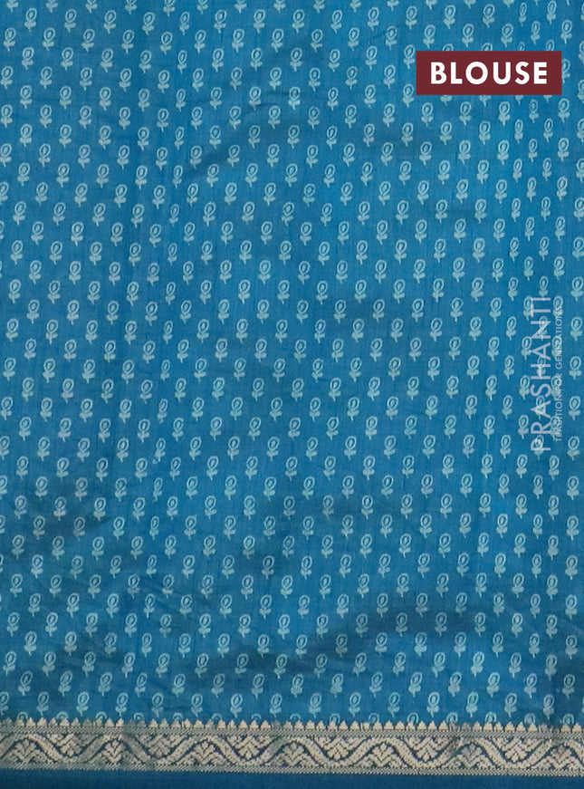 Semi raw silk saree cs blue with floral butta prints and zari woven border