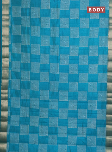 Semi raw silk saree teal blue with geometric prints and zari woven border