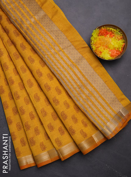 Semi raw silk saree mango yellow with allover paisley butta prints and zari woven border