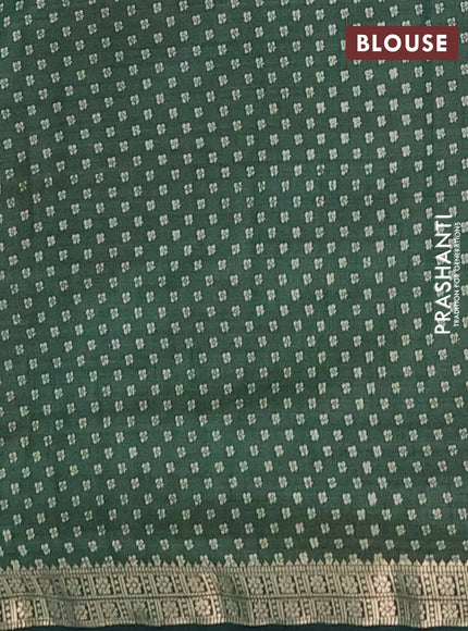 Semi raw silk saree green with allover butta prints and zari woven border