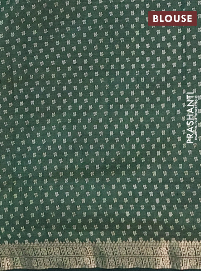 Semi raw silk saree green with allover butta prints and zari woven border