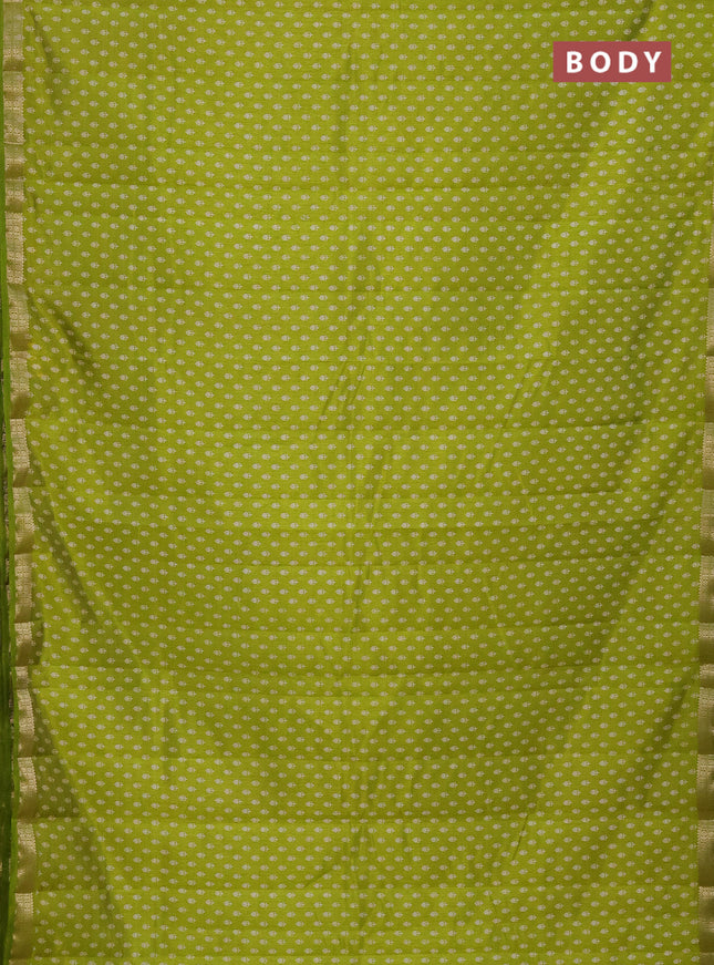 Semi raw silk saree fluorescent green with allover butta prints and zari woven border