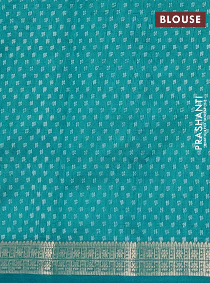 Semi raw silk saree teal blue with allover butta prints and zari woven border