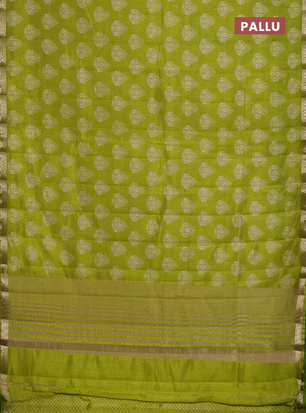 Semi raw silk saree light green with butta prints and zari woven border