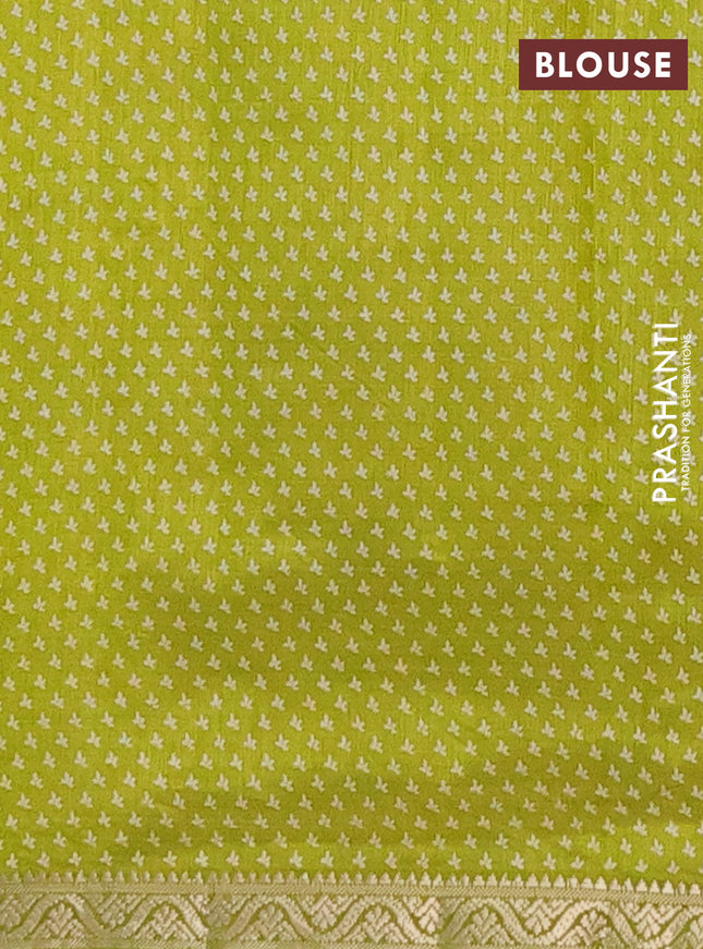 Semi raw silk saree light green with butta prints and zari woven border