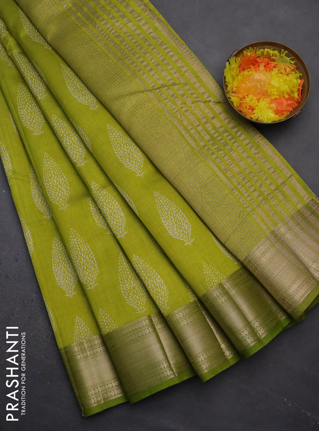 Semi raw silk saree light green with butta prints and zari woven border