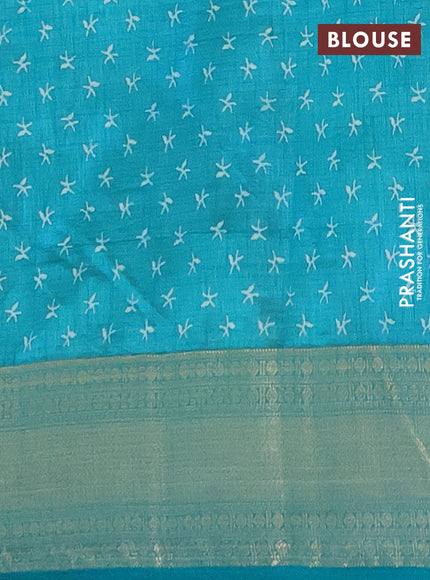 Semi raw silk saree teal blue with allover prints and zari woven border