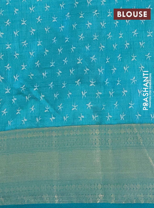 Semi raw silk saree teal blue with allover prints and zari woven border
