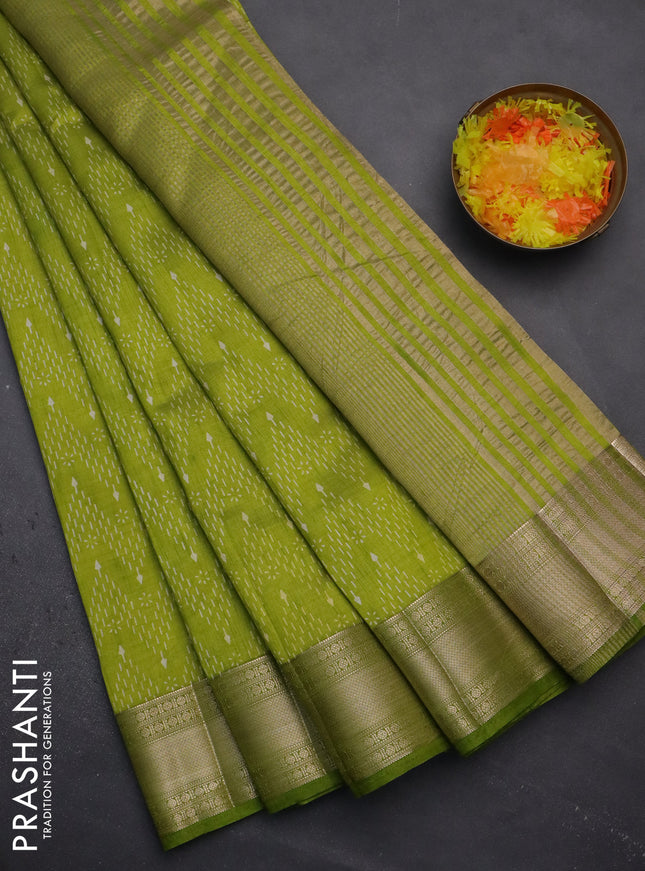 Semi raw silk saree light green with allover prints and zari woven border