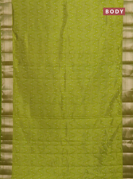 Semi raw silk saree light green with allover prints and zari woven border