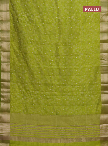 Semi raw silk saree light green with allover prints and zari woven border