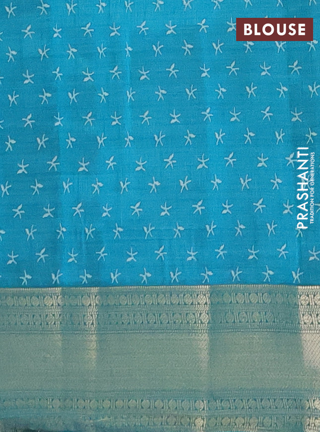 Semi raw silk saree teal blue with allover prints and zari woven border
