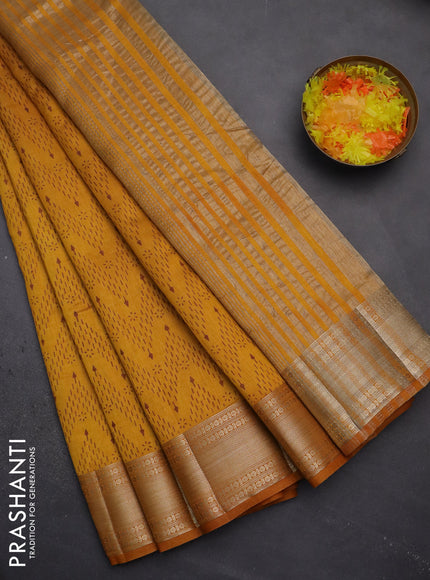 Semi raw silk saree mustard yellow with allover prints and zari woven border