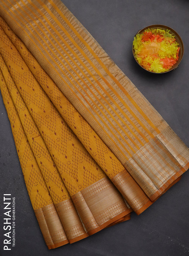 Semi raw silk saree mustard yellow with allover prints and zari woven border