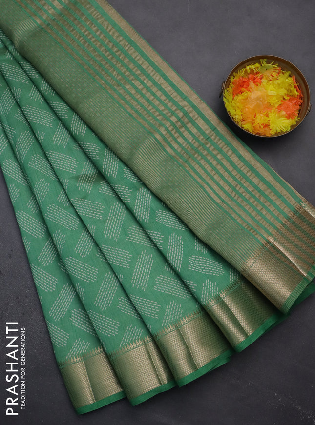 Semi raw silk saree teal green with allover prints and zari woven border