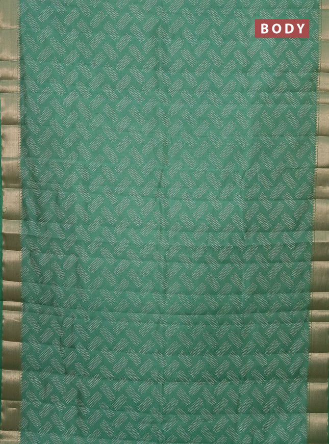 Semi raw silk saree teal green with allover prints and zari woven border