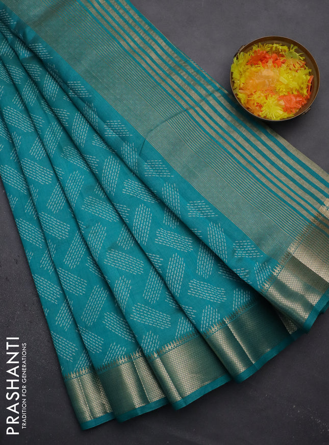 Semi raw silk saree teal blue with allover prints and zari woven border