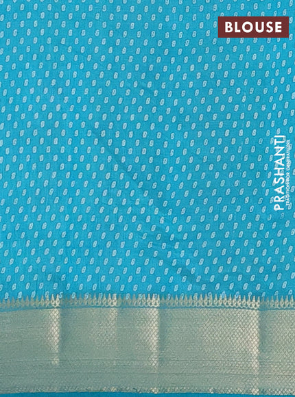 Semi raw silk saree teal blue with allover prints and zari woven border