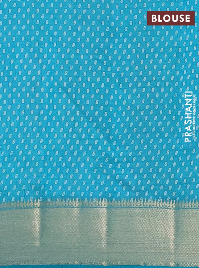 Semi raw silk saree teal blue with allover prints and zari woven border