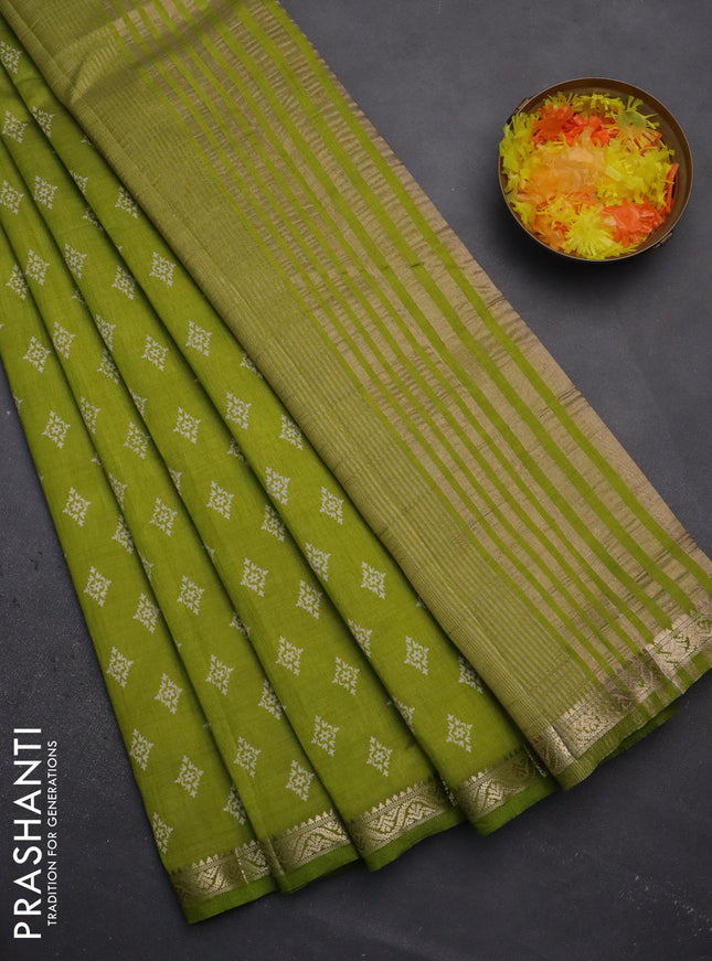Semi raw silk saree light green with allover butta prints and zari woven border