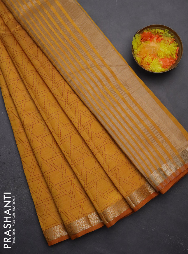 Semi raw silk saree mustard yellow with allover geometric prints and zari woven border