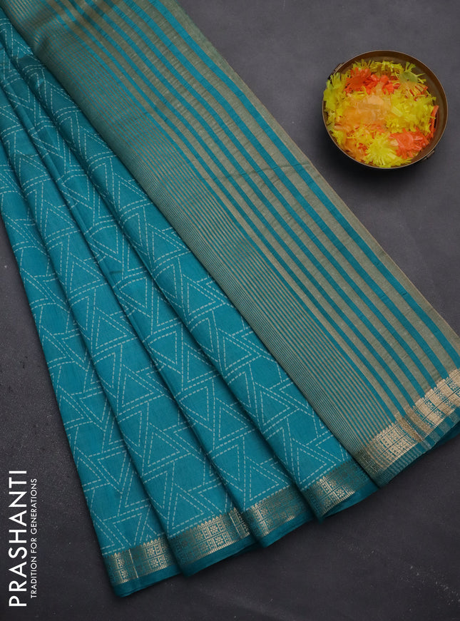 Semi raw silk saree teal blue with allover geometric prints and zari woven border