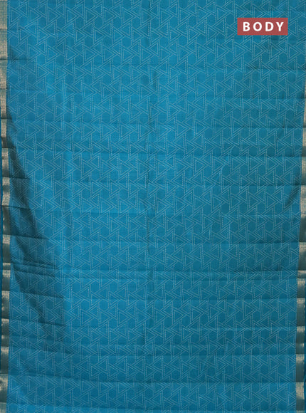 Semi raw silk saree teal blue with allover geometric prints and zari woven border