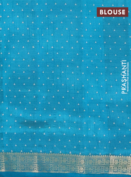 Semi raw silk saree teal blue with allover geometric prints and zari woven border