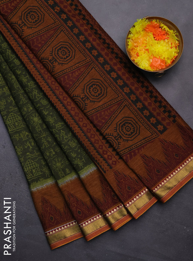 Muslin cotton saree sap green and dark mustard with allover warli prints and zari woven border