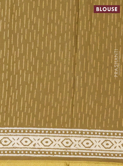 Muslin cotton saree mehendi green with butta prints and zari woven border