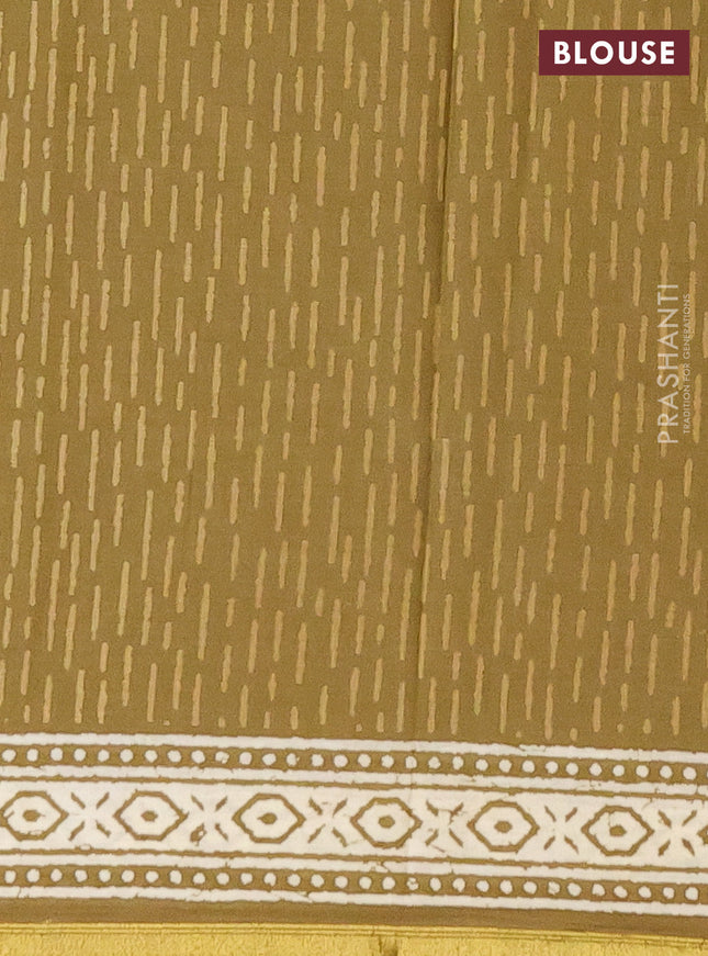 Muslin cotton saree mehendi green with butta prints and zari woven border