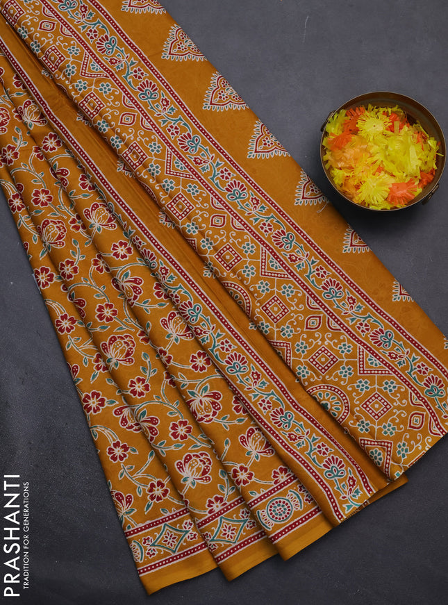 Muslin cotton saree mustard yellow with allover floral prints and printed border