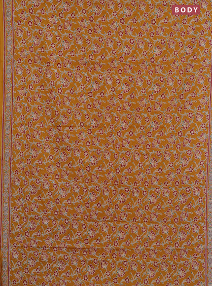 Muslin cotton saree mustard yellow with allover floral prints and printed border