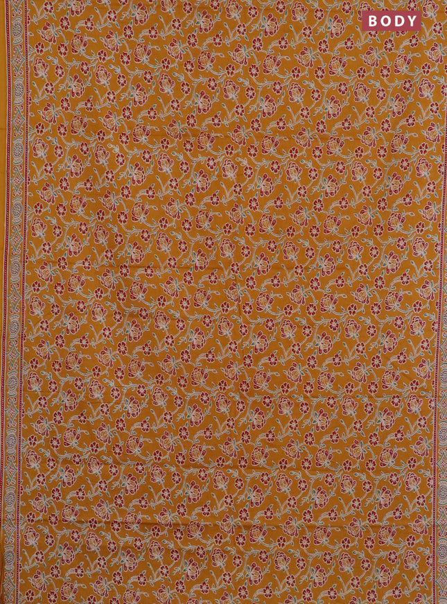 Muslin cotton saree mustard yellow with allover floral prints and printed border