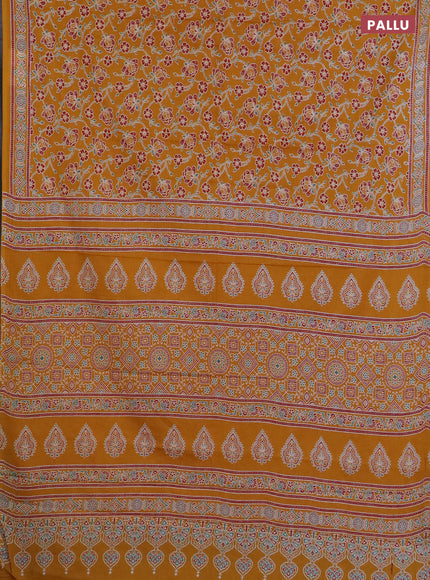 Muslin cotton saree mustard yellow with allover floral prints and printed border