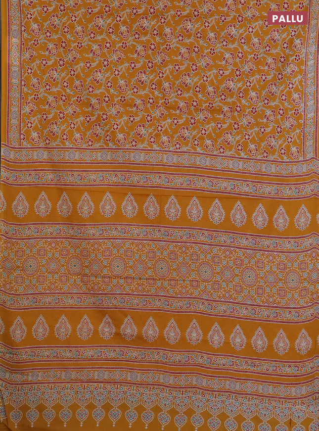 Muslin cotton saree mustard yellow with allover floral prints and printed border