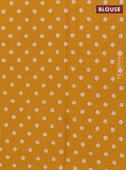 Muslin cotton saree mustard yellow with allover floral prints and printed border