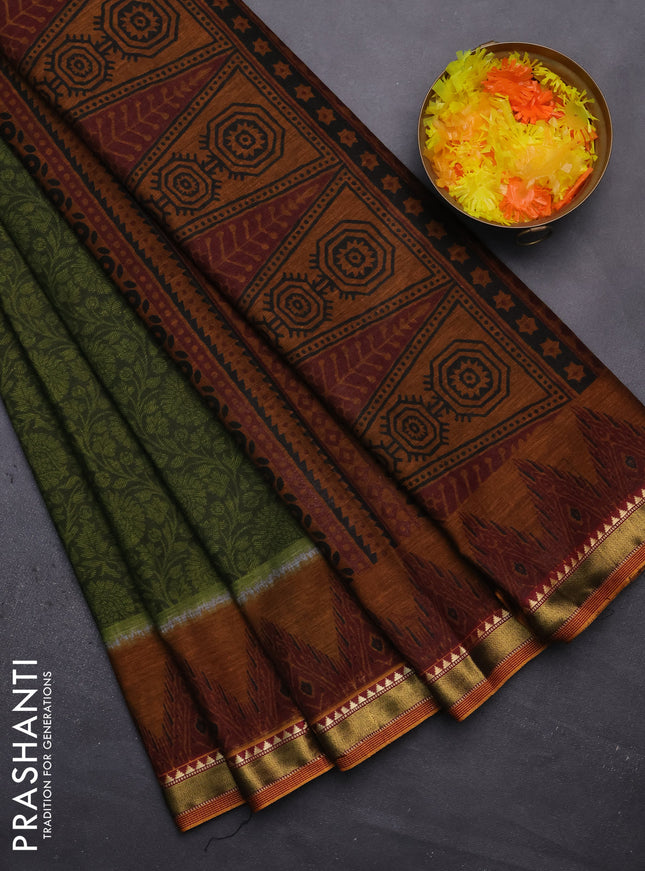 Muslin cotton saree sap green and dark mustard with allover prints and zari woven border