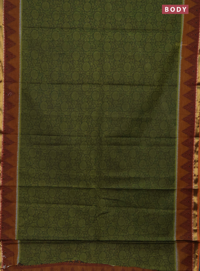 Muslin cotton saree sap green and dark mustard with allover prints and zari woven border
