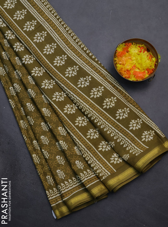 Muslin cotton saree mehendi green with allover dabu prints and zari woven border