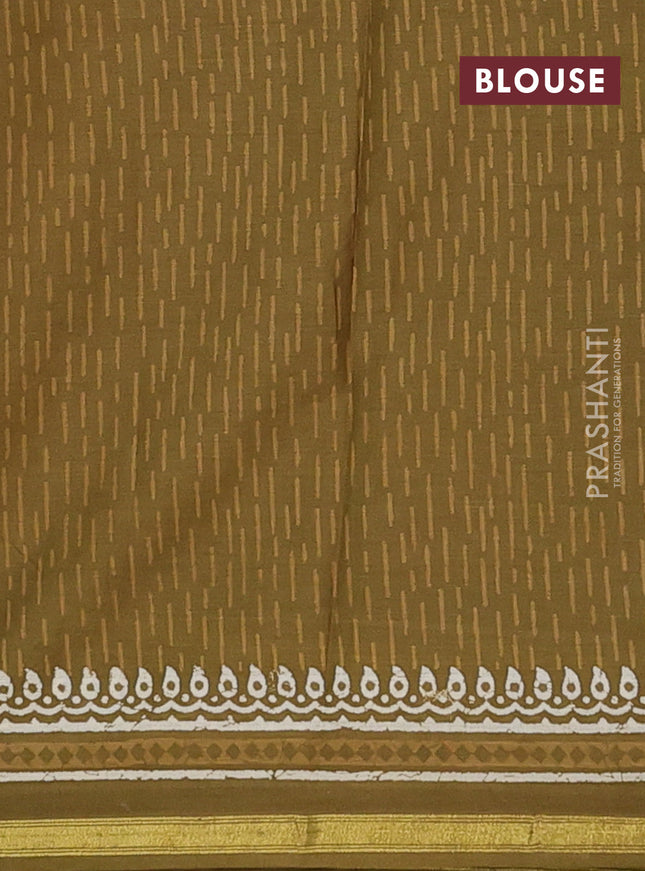 Muslin cotton saree mehendi green with allover dabu prints and zari woven border