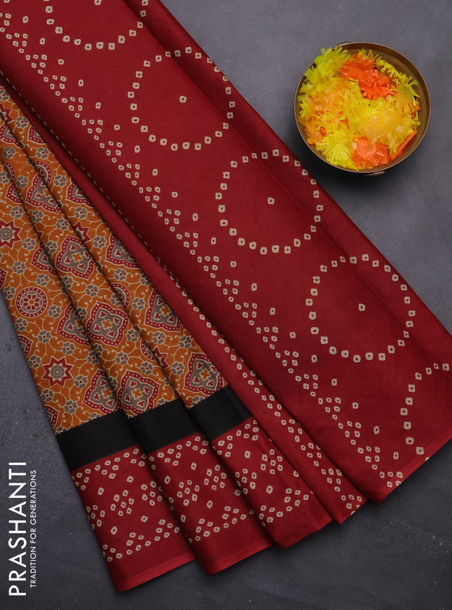 Muslin cotton saree dark mustard and maroon with ajrakh prints and printed border