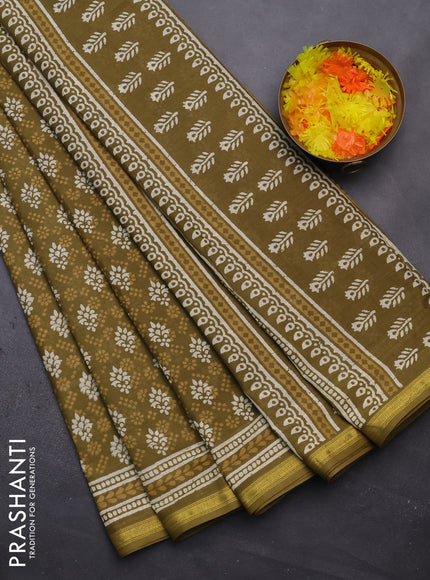 Muslin cotton saree mehendi green with allover prints and zari woven border