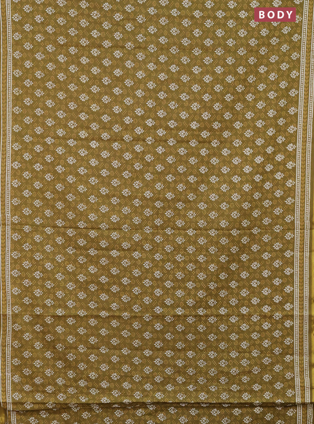 Muslin cotton saree mehendi green with allover prints and zari woven border