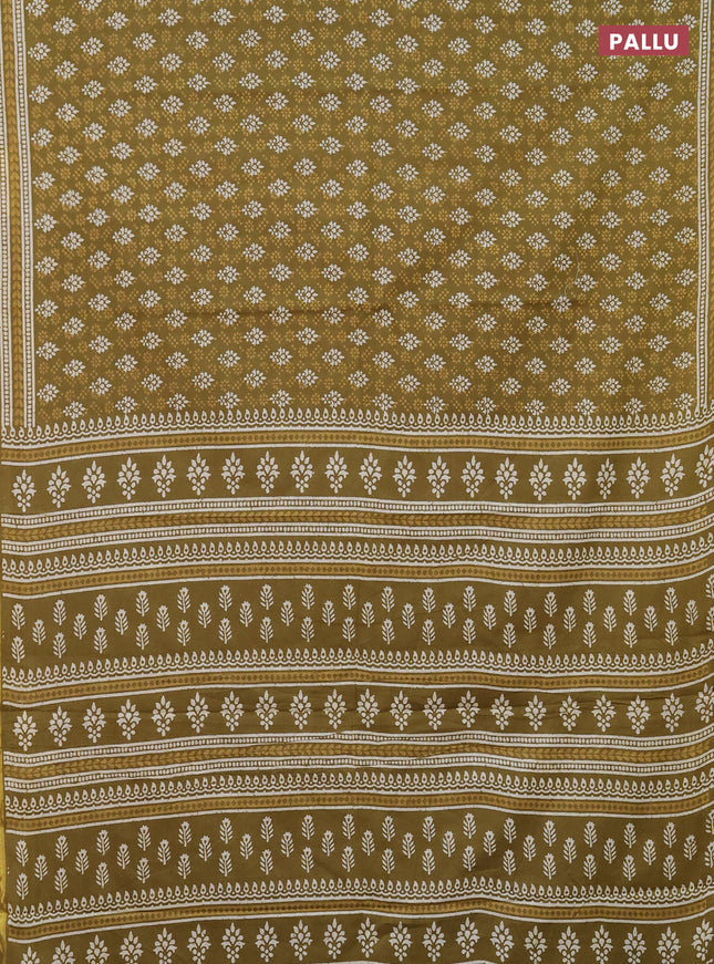 Muslin cotton saree mehendi green with allover prints and zari woven border