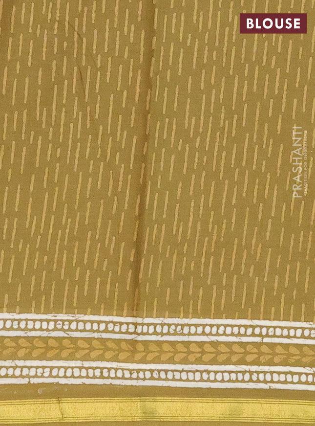 Muslin cotton saree mehendi green with allover prints and zari woven border